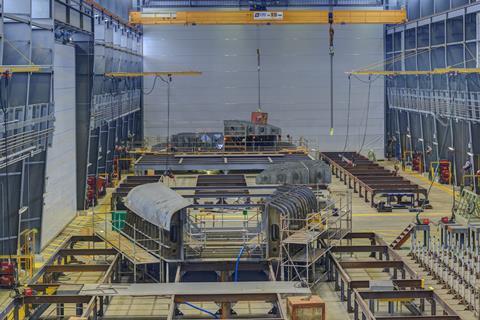 Inside a huge production hall is evidence of the yard's efforts towards repeatability in block construction